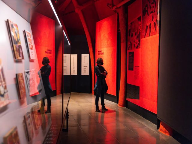 Museum guest views the Asian Comics exhibit at MoPOP